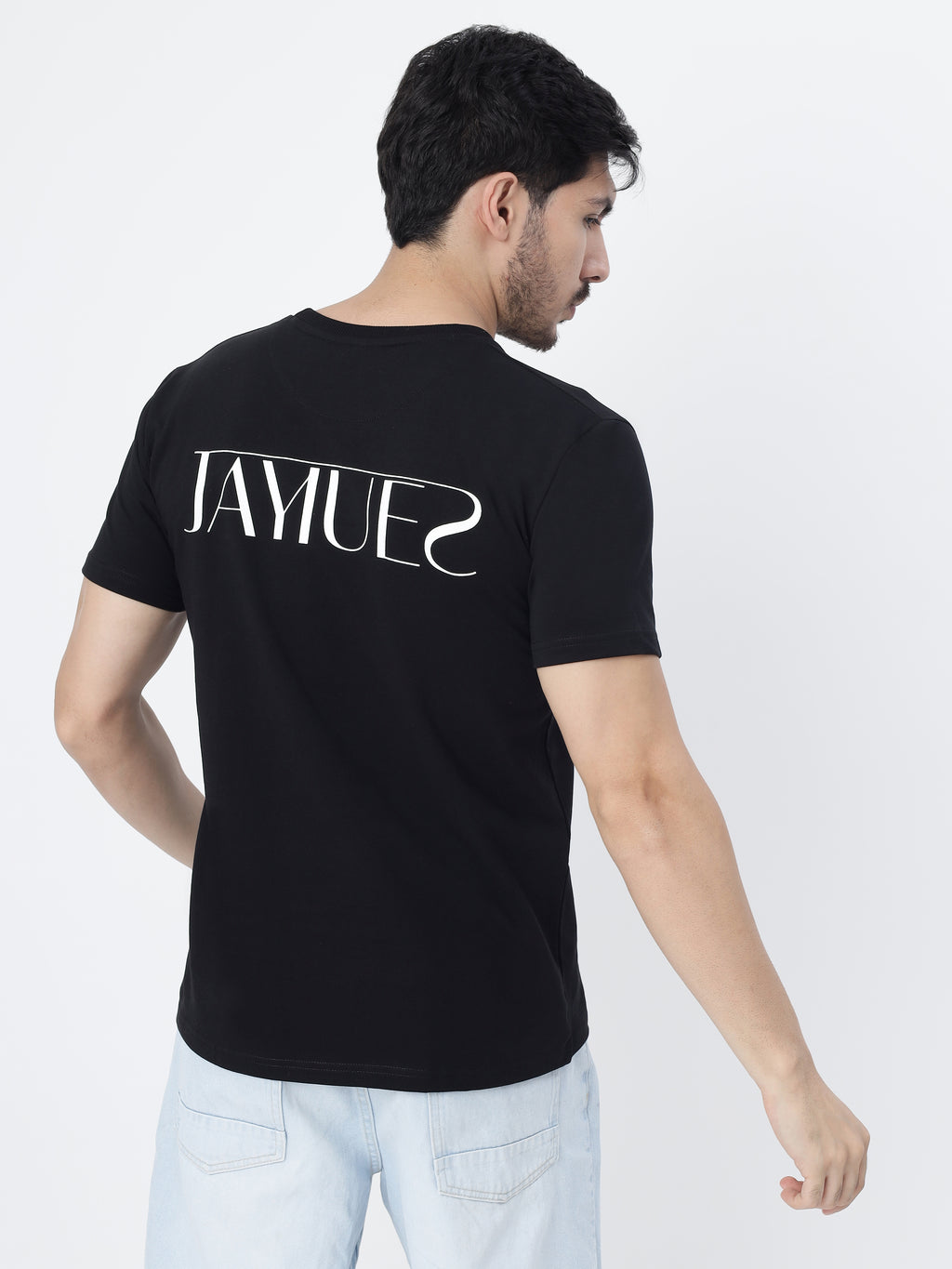Model wearing Black jayhues marque t-shirt showcasing the back print, on a white background.