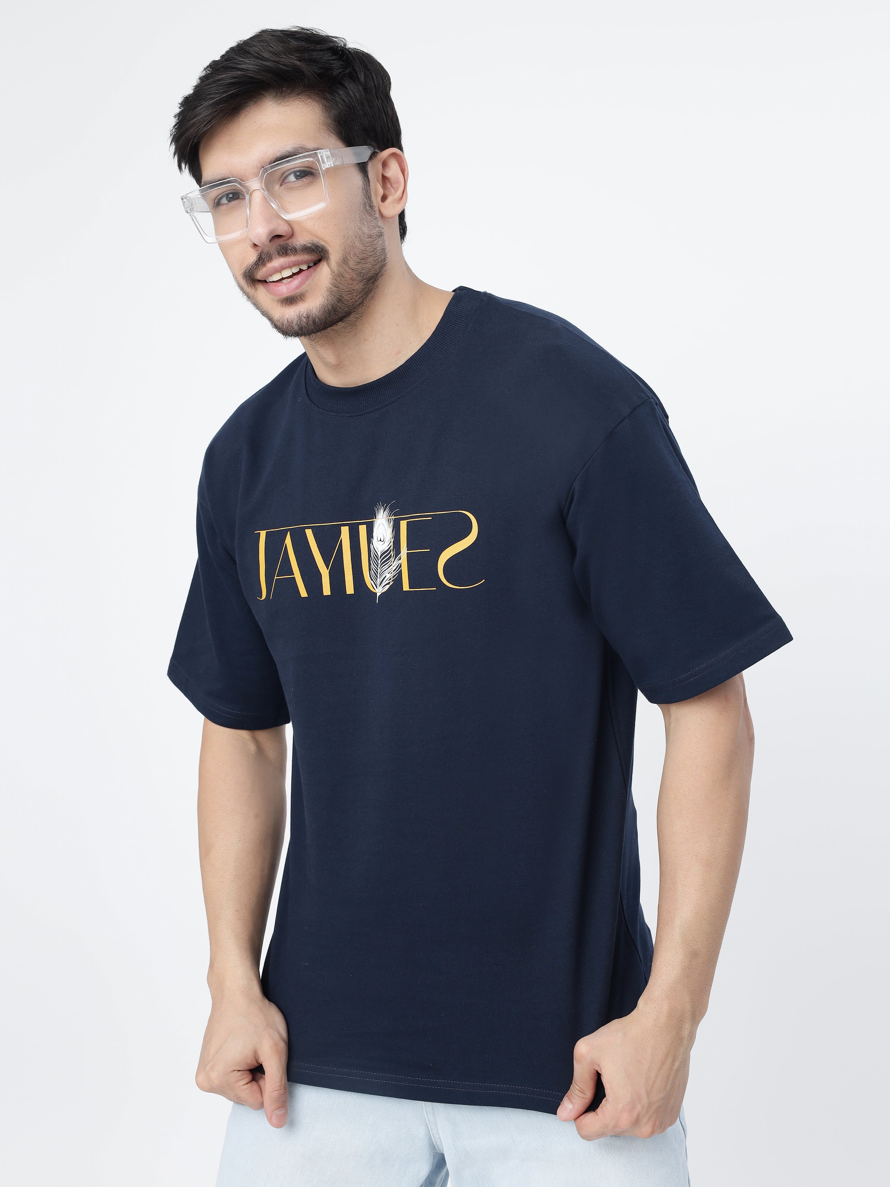 Model showcasing the front print of Navy peacock feather oversized t-shirt.