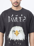 Closeup of a model showcasing the front print of Charcoal fat eagle oversized t-shirt on a white background.