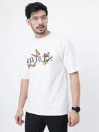 Model showcasing the front print of White orange butterflies oversized t-shirt on a grey background.