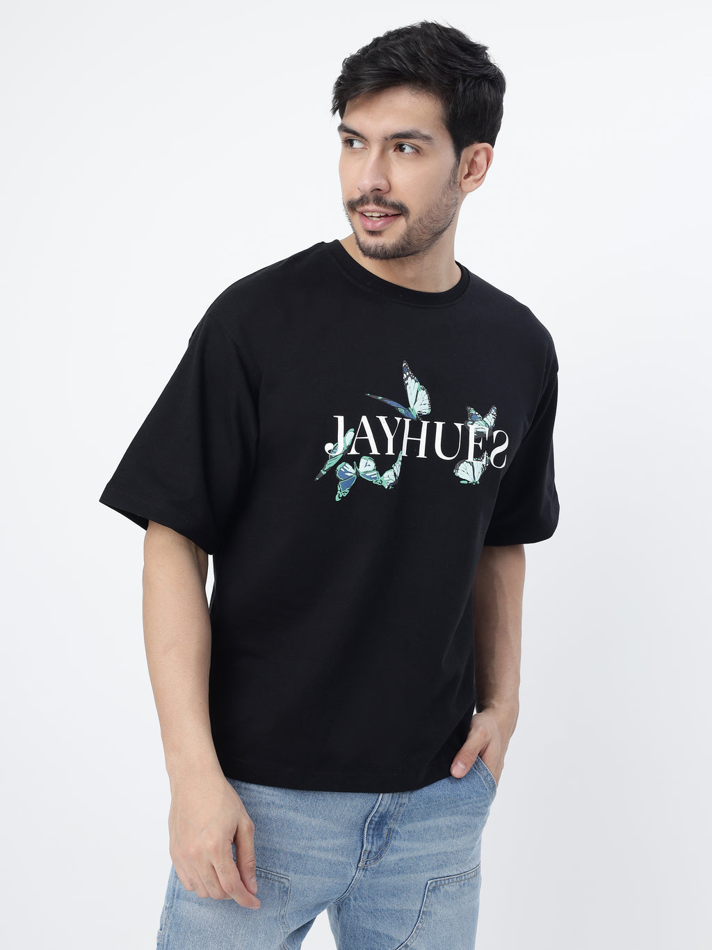 Model showcasing the front side of Black blue butterflies oversized t-shirt, on a white background.