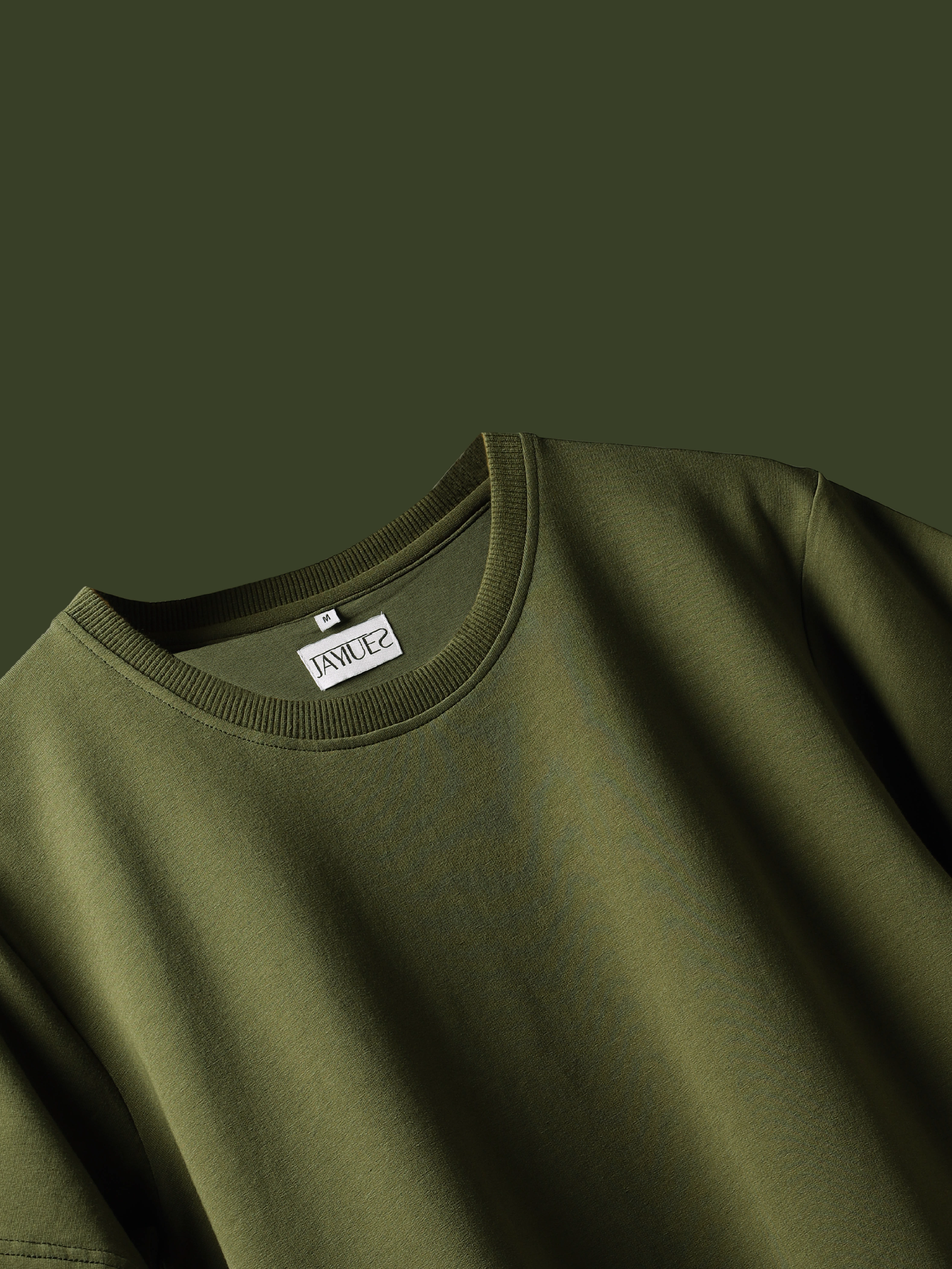 Jayhues olive green basic t-shirt with a brand label on a dark green background