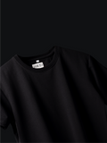 Jayhues black basic t-shirt with a brand label on a black background