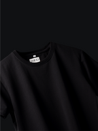Jayhues black basic t-shirt with a brand label on a black background