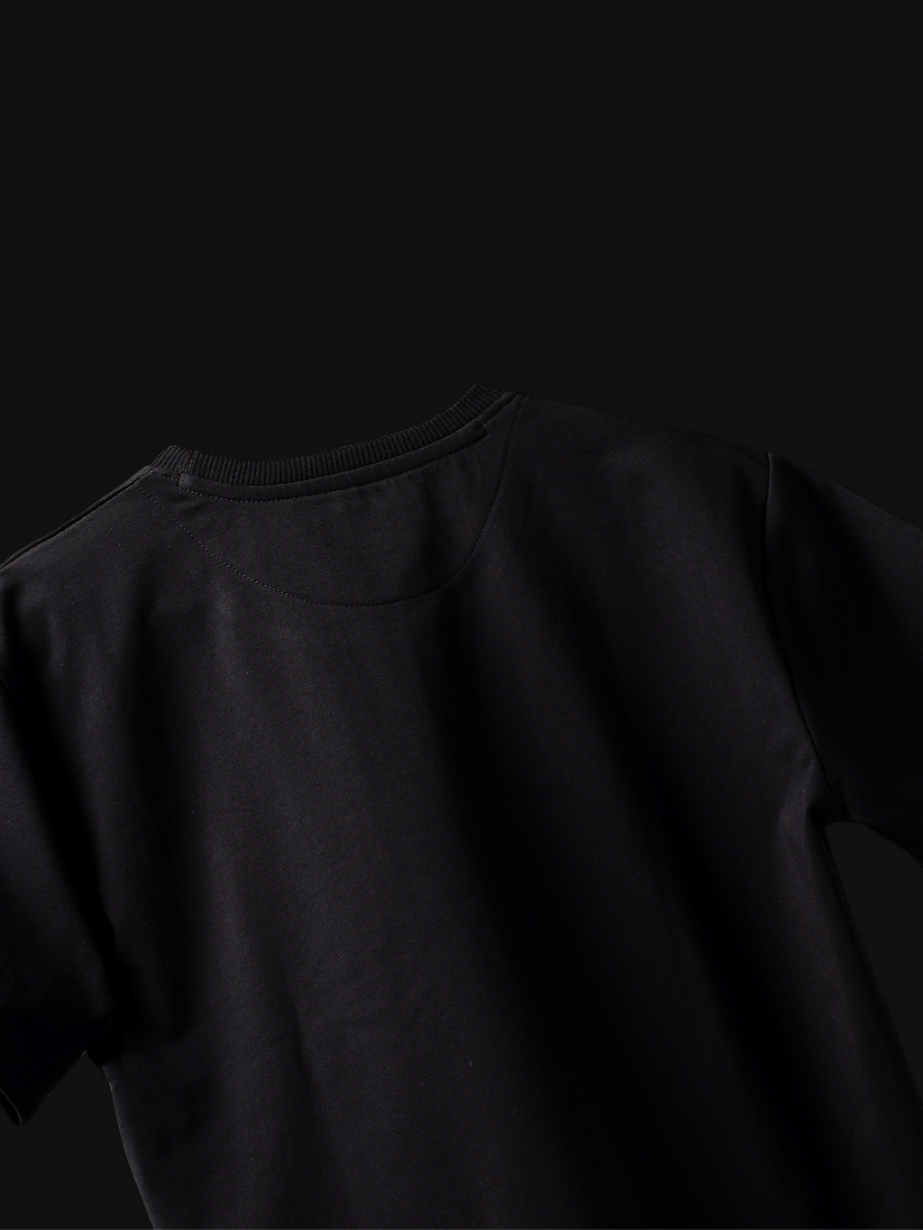 Jayhues black basic t-shirt on a black background
