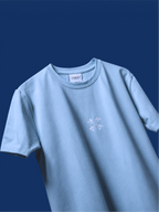A light blue basic mark t-shirt with a small white hd printed logo on the chest, displayed against a solid dark blue background.