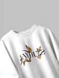 White yellow butterflies oversized t-shirt on a grey background.