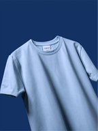 The light blue basic t-shirt, set against a solid dark blue background.