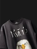 Charcoal fat eagle oversized t-shirt on a dark background.