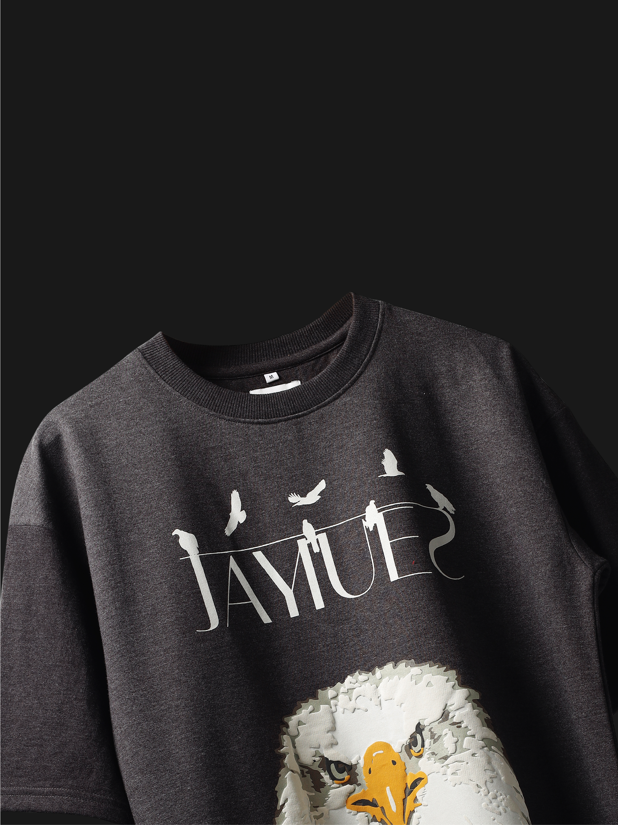Charcoal fat eagle oversized t-shirt on a dark background.