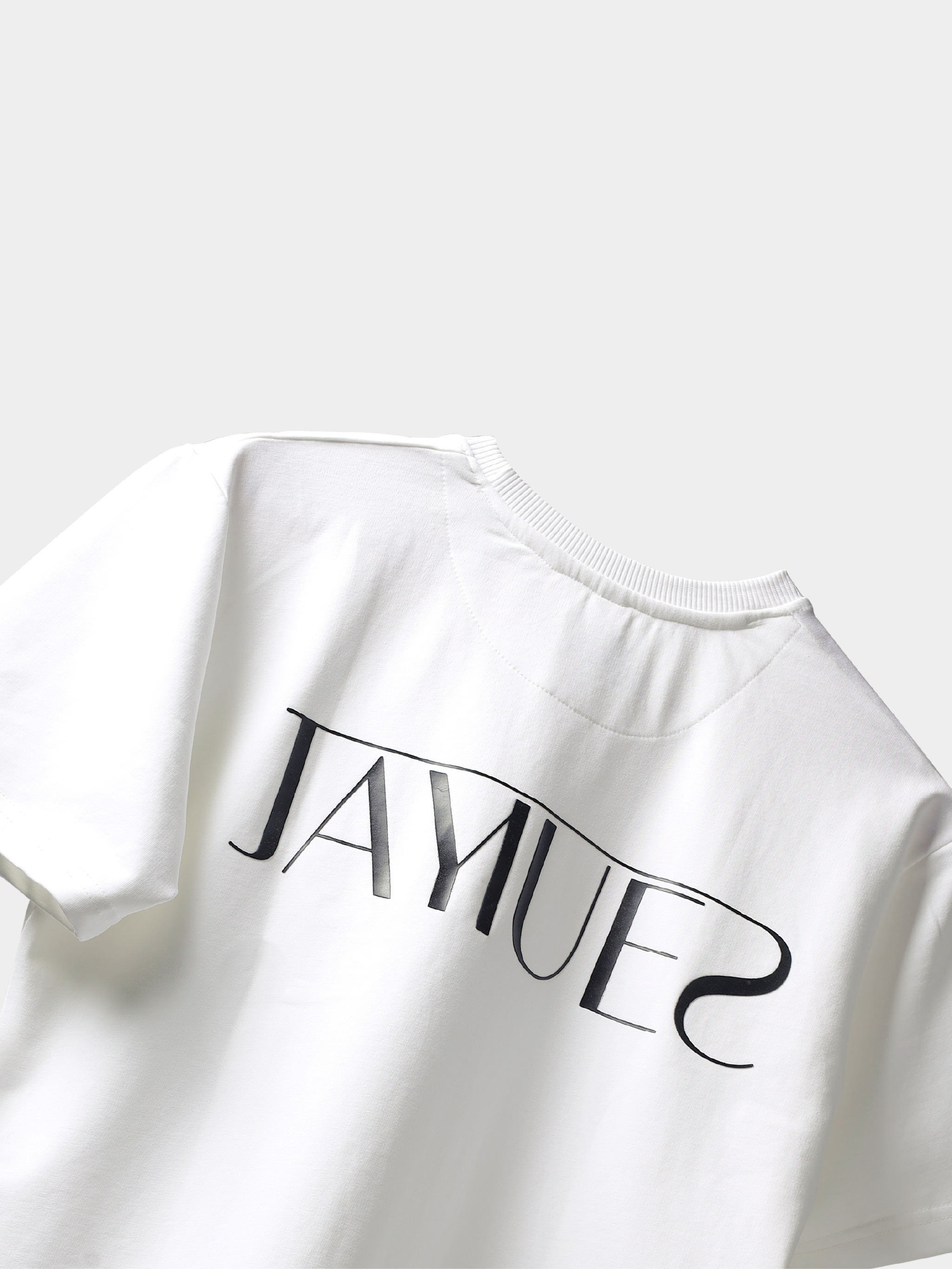 White jayhues marque t-shirt backside with black hd jayhues logo on a light gray background