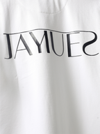 closeup of hd back logo on White jayhues marque t-shirt