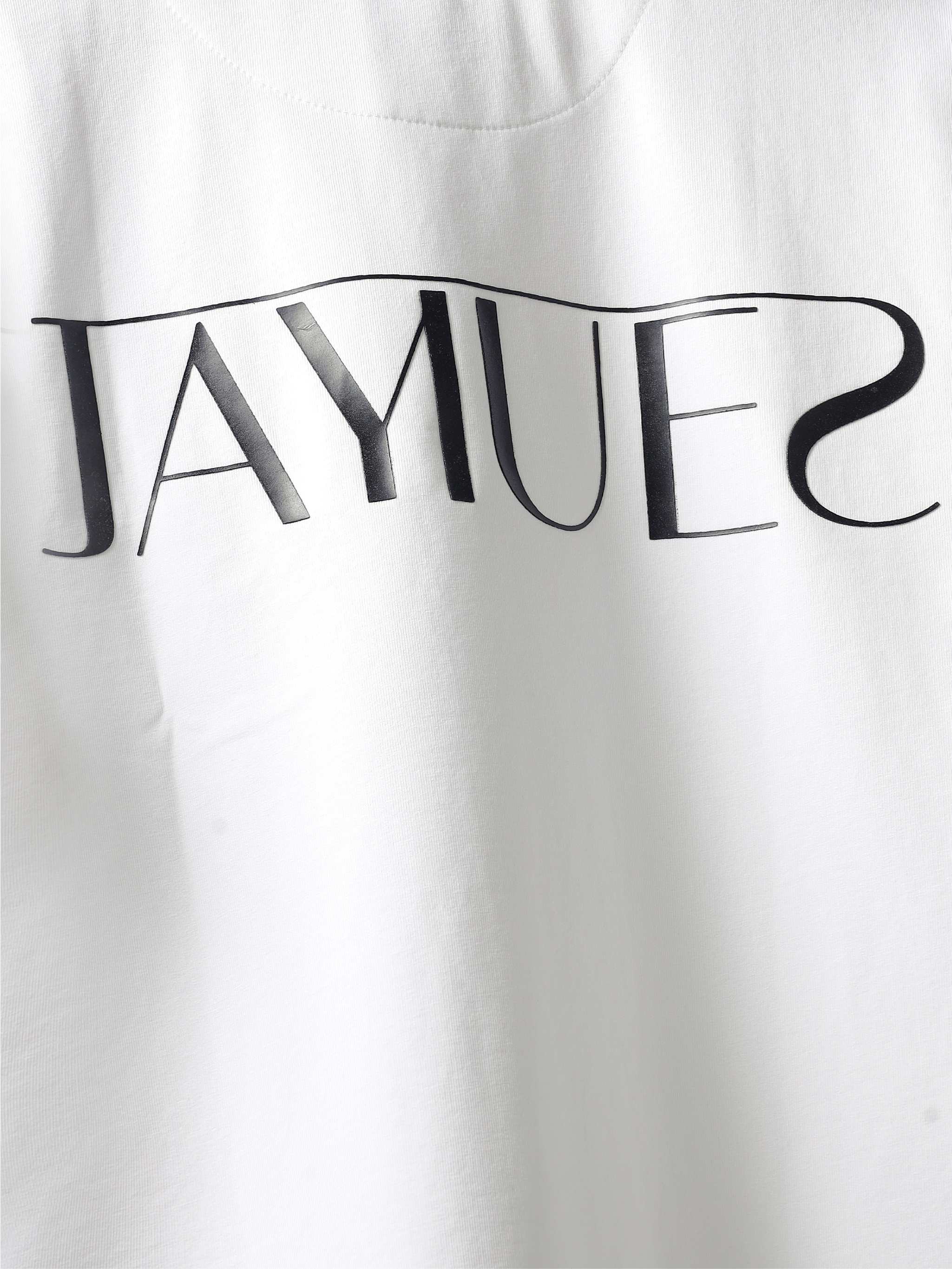 closeup of hd back logo on White jayhues marque t-shirt