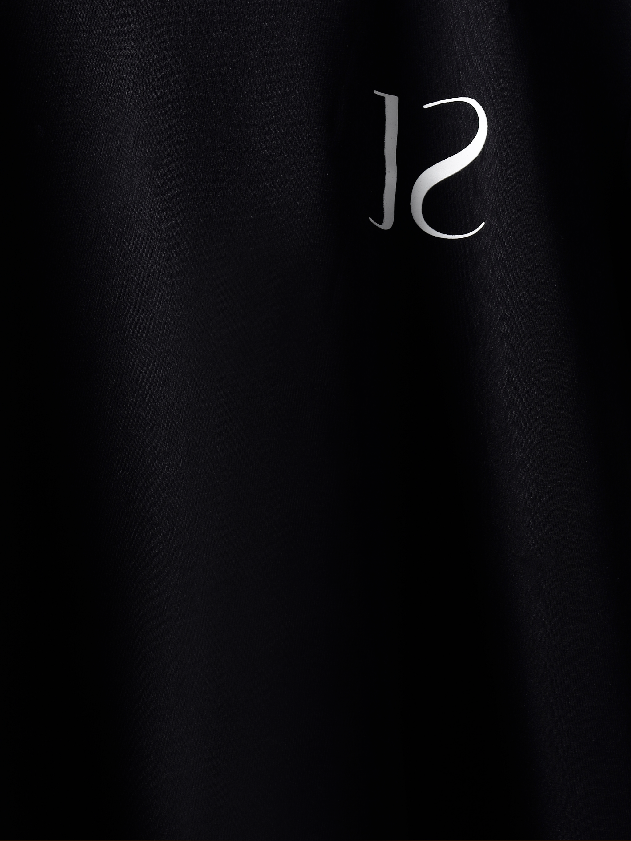 closeup of Black jayhues marque t-shirt front side.