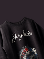 Charcoal Pisces Koi oversized t-shirt on a dark background.