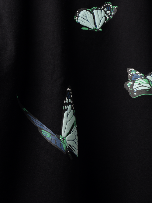 Close up of Butterfly pattern on a back of Black blue butterflies oversized t-shirt.