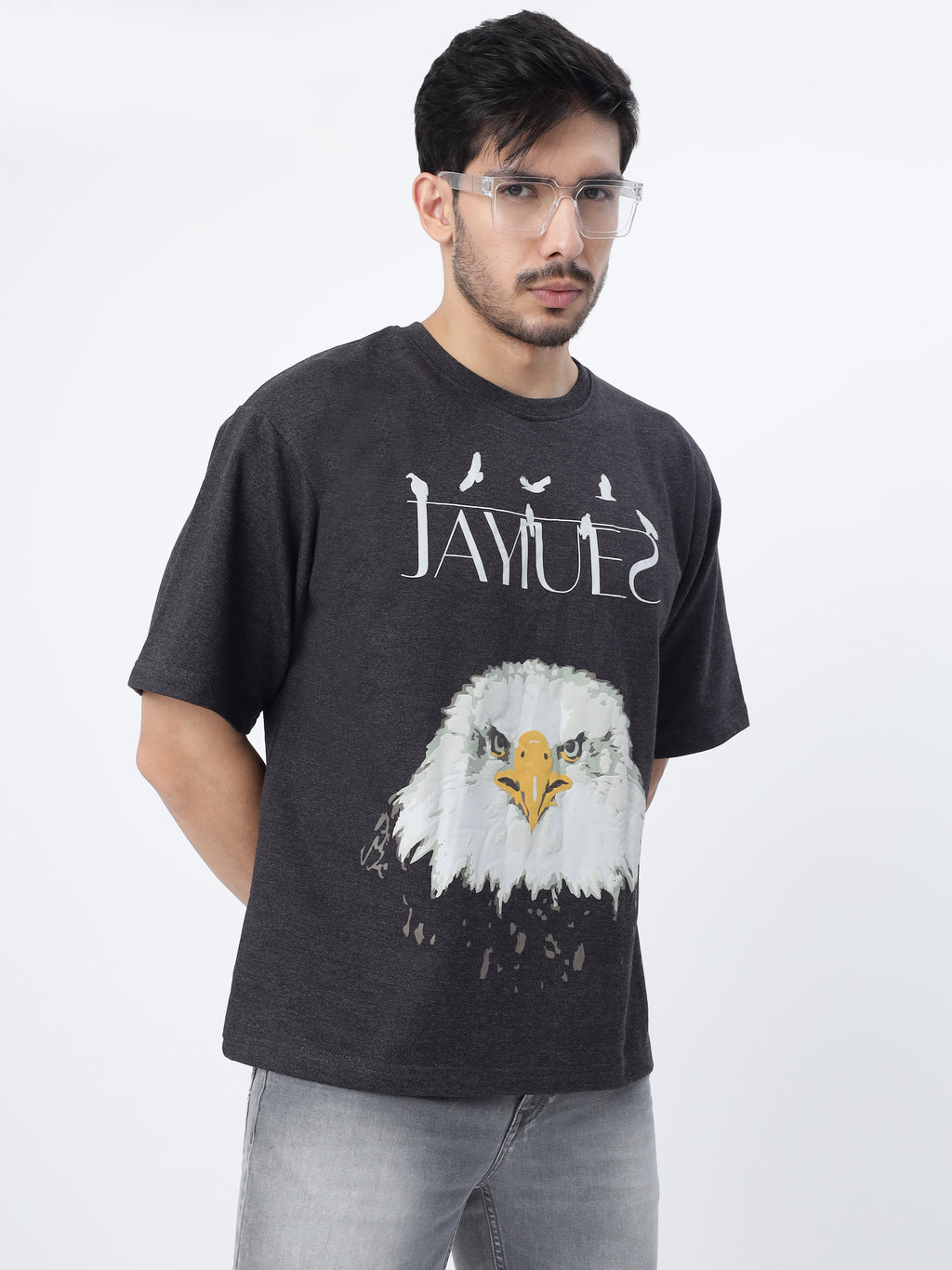 Model showcasing the front print of Charcoal fat eagle oversized t-shirt on a white background.