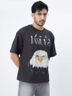 Model showcasing the front print of Charcoal fat eagle oversized t-shirt on a white background.