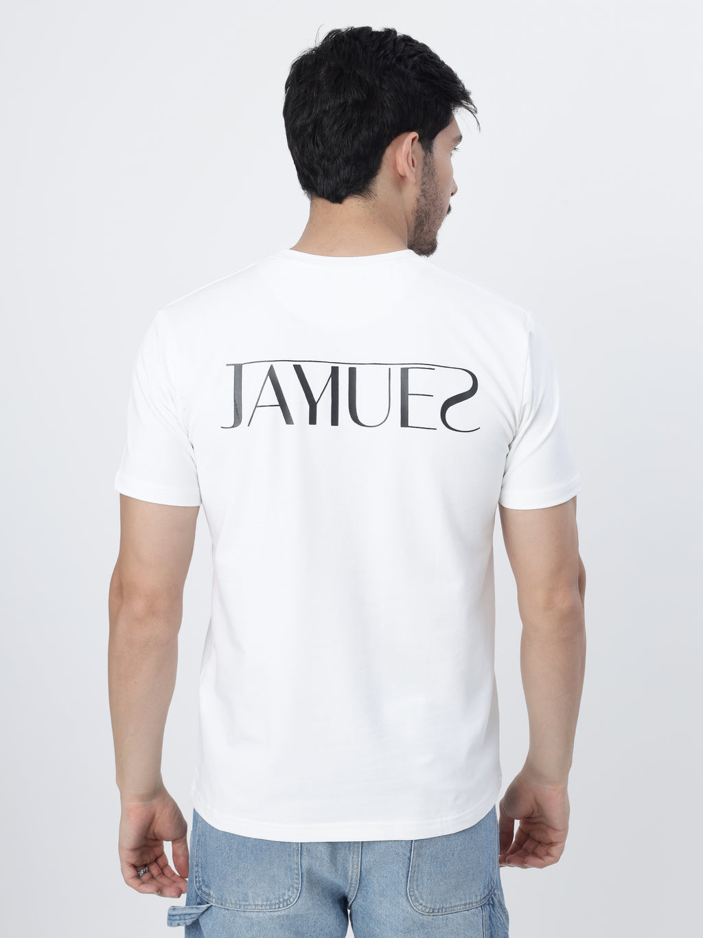 A model wearing the White jayhues marque t-shirt showcasing the back print of the shirt.