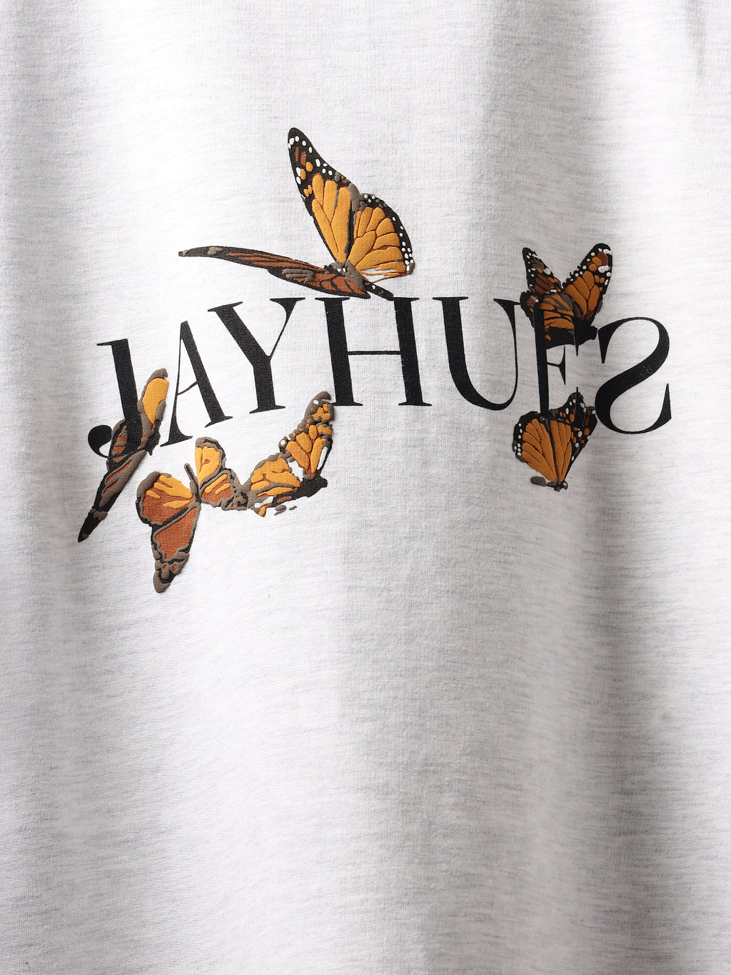 Front closeup of White orange butterflies oversized t-shirt.